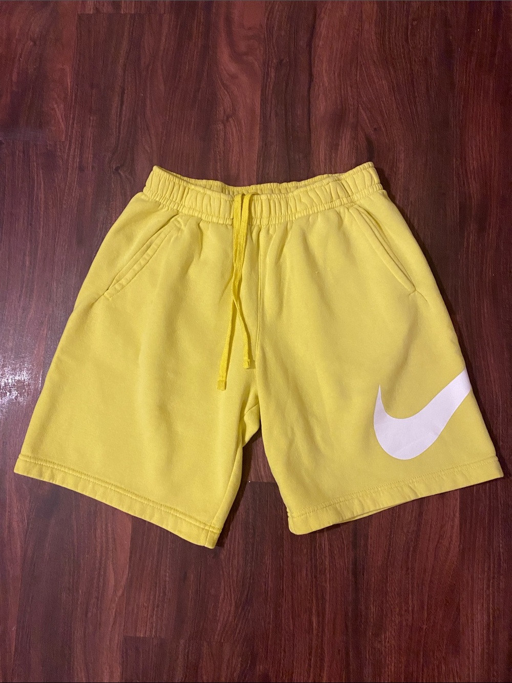 Nike Men's Yellow Athletic Shorts with White Swoosh